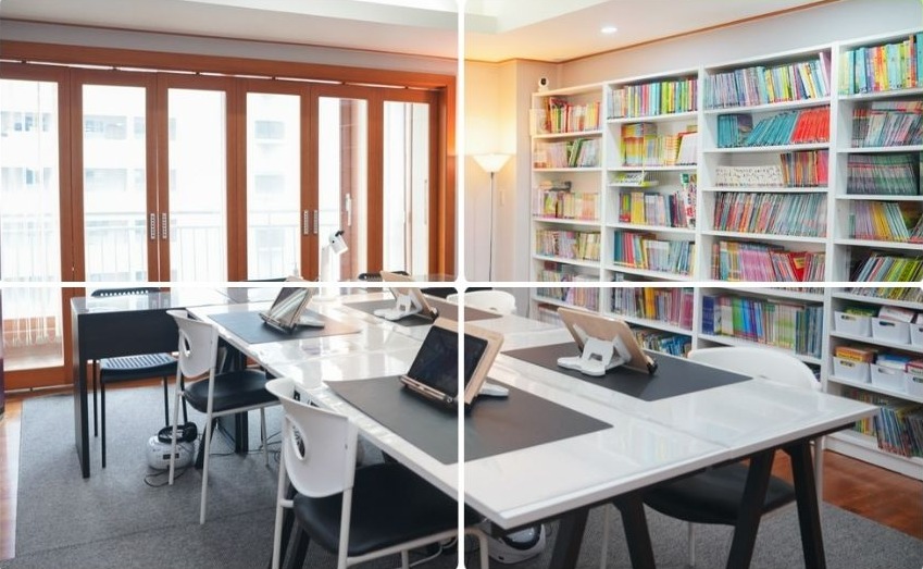 에버그린영어도서관 내부: 흰 서가에 가득한 영어 원서와 원목 창틀, 학습 테이블
